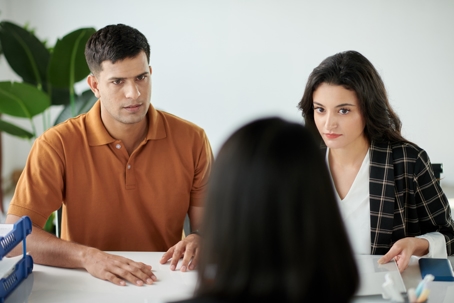couple having a serious discussion with a professional